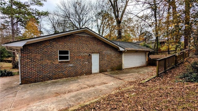 view of property exterior with a garage