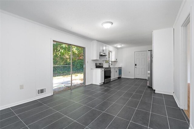 kitchen featuring under cabinet range hood, refrigerator, white cabinetry, visible vents, and electric range oven