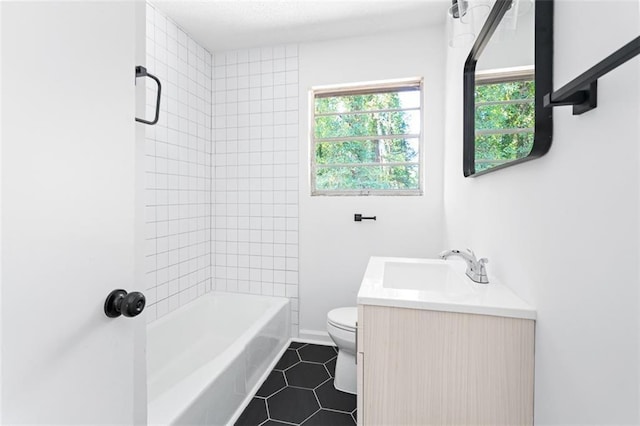 full bathroom with tile patterned flooring, tub / shower combination, vanity, and toilet