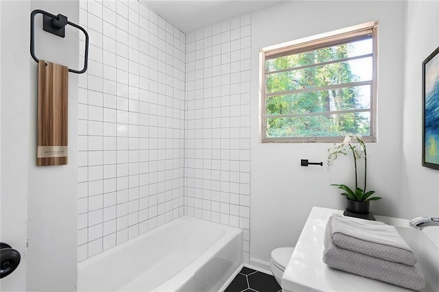 full bathroom featuring tile patterned flooring, baseboards, shower / tub combination, and toilet