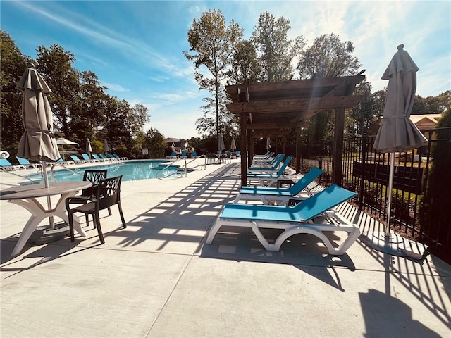 view of swimming pool with a patio