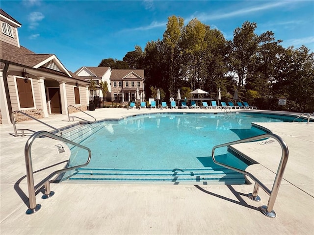 view of swimming pool featuring a patio