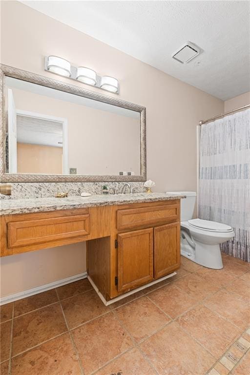 full bath with visible vents, toilet, a shower with shower curtain, tile patterned floors, and vanity