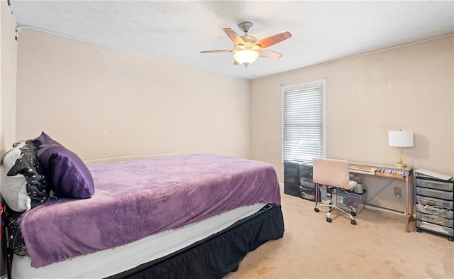 bedroom featuring carpet and a ceiling fan