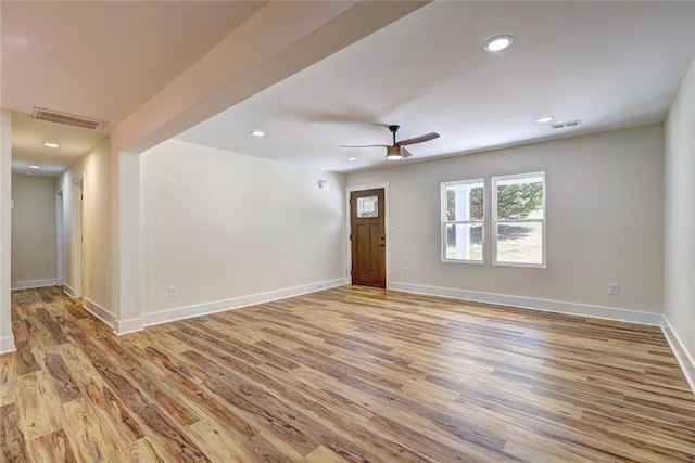 unfurnished room featuring ceiling fan and light hardwood / wood-style flooring