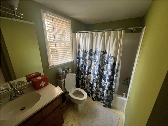 full bathroom with tile patterned floors, shower / bath combination with curtain, vanity, and toilet