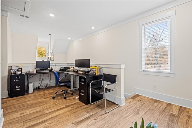 office with a wealth of natural light, light hardwood / wood-style flooring, and lofted ceiling