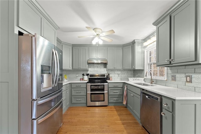 4010 Catawba Rdg, Gainesville, GA 30506 - kitchen with sink, appliances with stainless steel finishes, gray cabinets, and light hardwood / wood-style floors