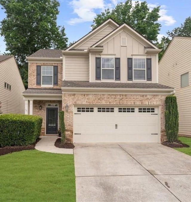 3607 Archgate Ct, Alpharetta, GA 30004 - view of front of property with an attached garage, concrete driveway, a front lawn, board and batten siding, and brick siding