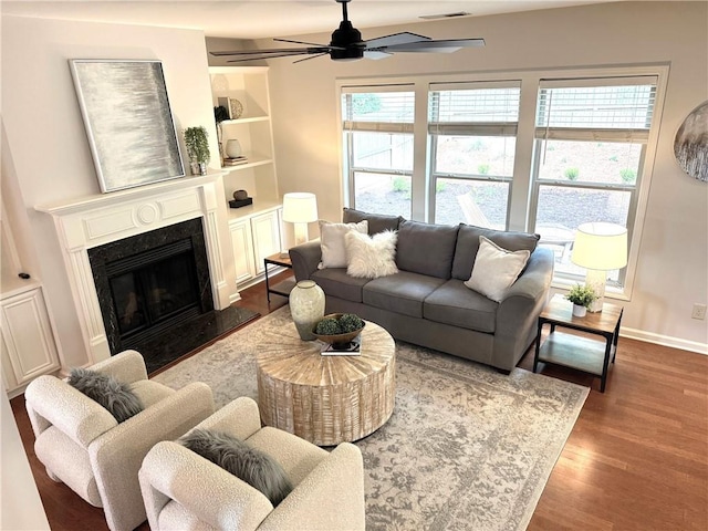 3607 Archgate Ct, Alpharetta, GA 30004 - living room with dark wood-style floors, a ceiling fan, a premium fireplace, and baseboards