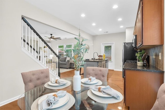 3607 Archgate Ct, Alpharetta, GA 30004 - dining room featuring recessed lighting, stairs, baseboards, ceiling fan, and light wood-type flooring