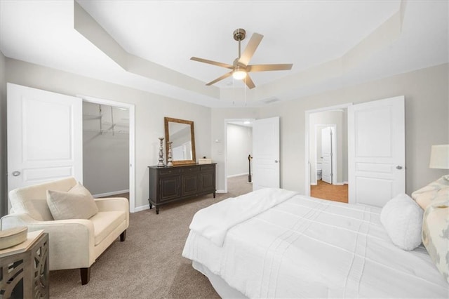 3607 Archgate Ct, Alpharetta, GA 30004 - bedroom with a tray ceiling, a spacious closet, light carpet, a closet, and baseboards