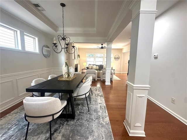3607 Archgate Ct, Alpharetta, GA 30004 - dining space with ceiling fan, dark wood-style flooring, decorative columns, crown molding, and a raised ceiling