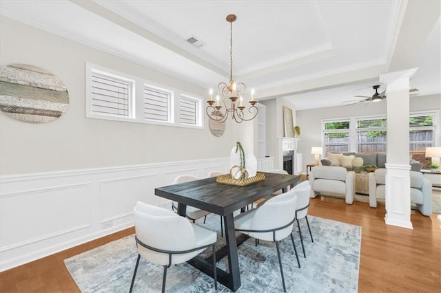 3607 Archgate Ct, Alpharetta, GA 30004 - dining room featuring decorative columns, wood finished floors, wainscoting, a ceiling fan, and ornamental molding