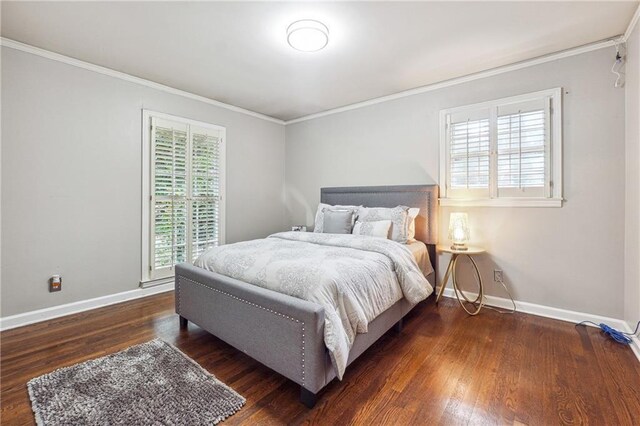 bedroom with ornamental molding and dark wood-type flooring