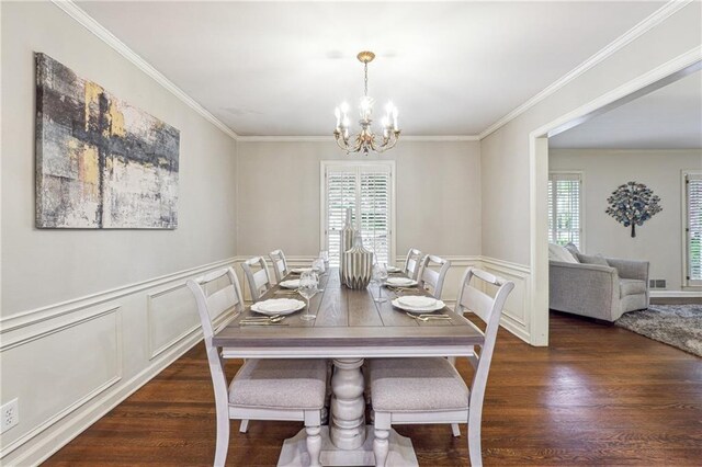 dining room with a chandelier, dark hardwood / wood-style floors, and ornamental molding