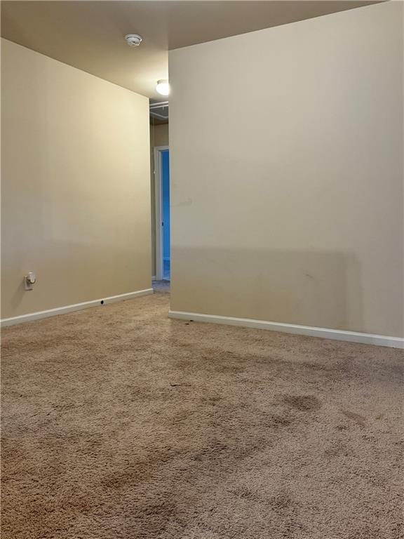 7703 Hansel Ln, Lithonia, GA 30058 - carpeted empty room with a smoke detector and baseboards