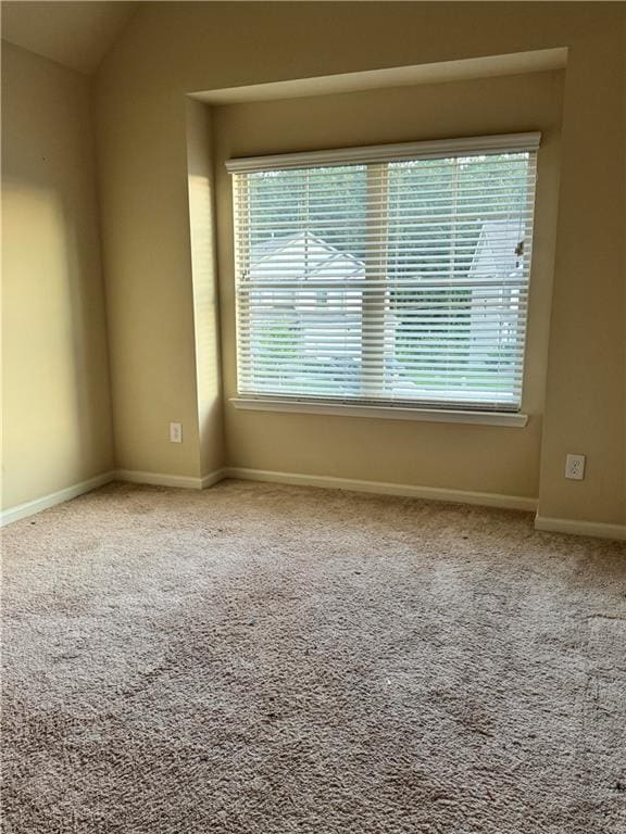 7703 Hansel Ln, Lithonia, GA 30058 - carpeted empty room with healthy amount of natural light