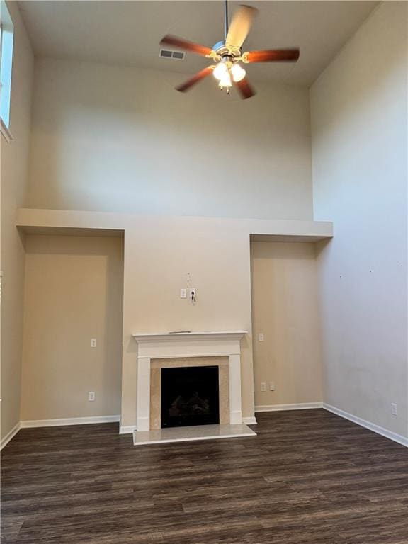 7703 Hansel Ln, Lithonia, GA 30058 - unfurnished living room with a ceiling fan, wood finished floors, and a high end fireplace