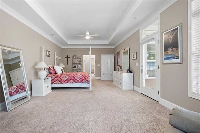 bedroom with light carpet, ornamental molding, access to outside, ceiling fan, and a tray ceiling