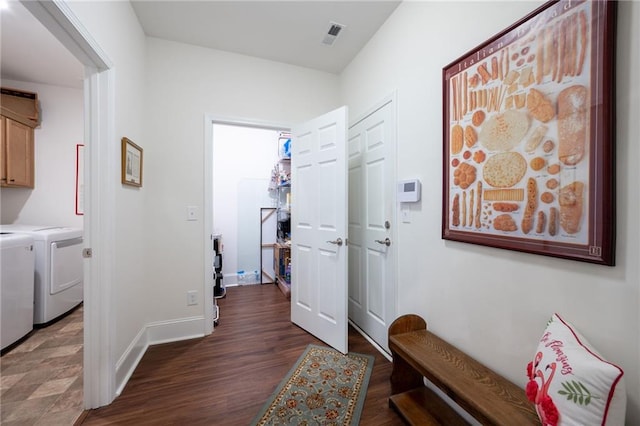 hallway with separate washer and dryer