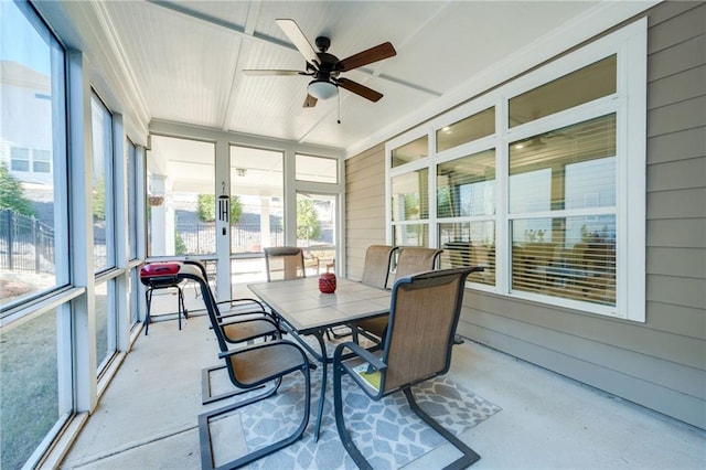 sunroom / solarium featuring ceiling fan