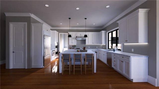 kitchen featuring a center island, dark wood-type flooring, white cabinets, hanging light fixtures, and stainless steel appliances