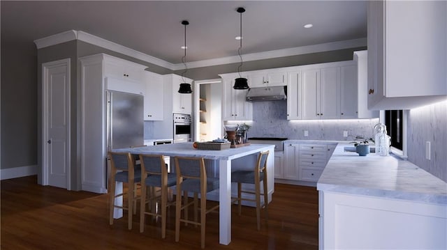 kitchen featuring a kitchen island, white cabinetry, pendant lighting, and stainless steel appliances