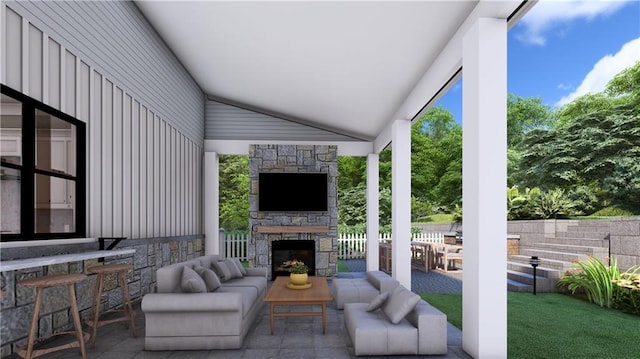 view of patio / terrace with an outdoor living space with a fireplace