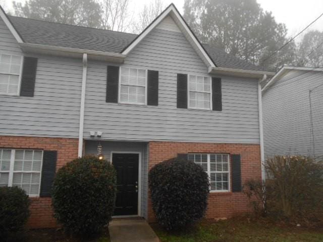 view of front of property featuring brick siding