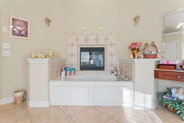 bathroom featuring tile patterned flooring, a fireplace, ornamental molding, and a tub to relax in