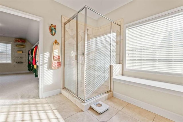 bathroom featuring tile patterned floors and a healthy amount of sunlight