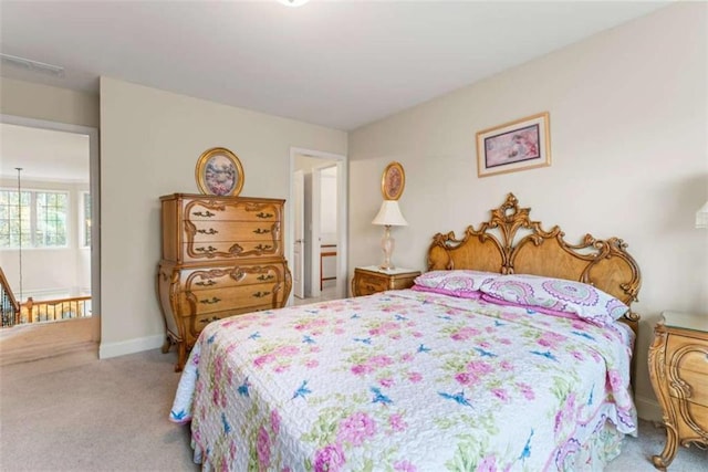 bedroom featuring light colored carpet