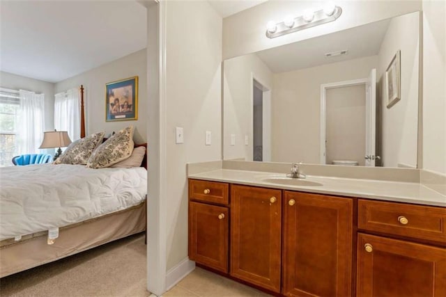 carpeted bedroom featuring sink