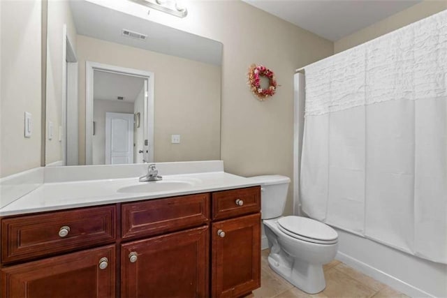 full bathroom with toilet, vanity, tile patterned floors, and tub / shower combination