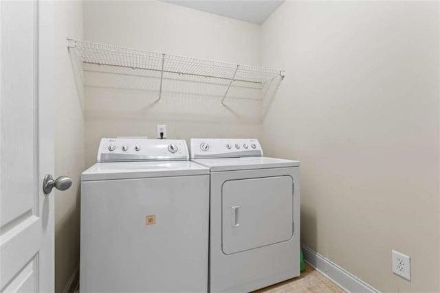 washroom with washing machine and dryer