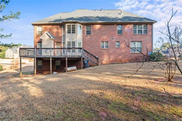 back of property with a wooden deck