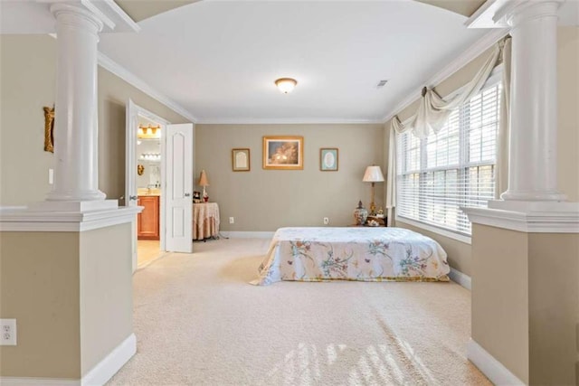 carpeted bedroom featuring ensuite bathroom, crown molding, and multiple windows