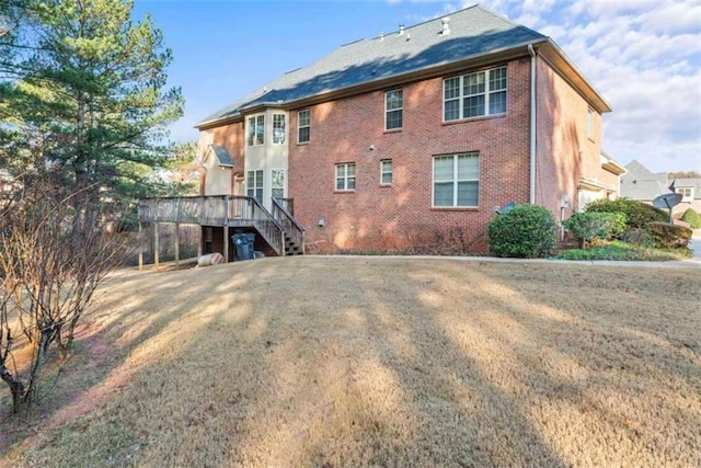 back of property featuring a deck