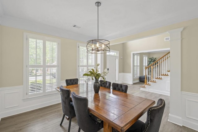 1465 Laleiah Dr, Cumming, GA 30041 - dining area with a wainscoted wall, visible vents, a decorative wall, and a chandelier