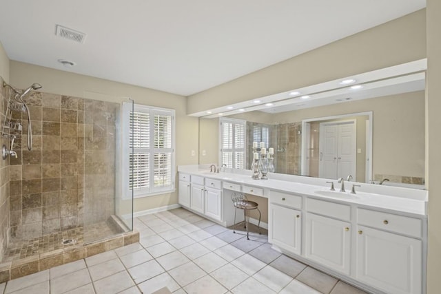 1465 Laleiah Dr, Cumming, GA 30041 - full bath with a sink, double vanity, tile patterned floors, visible vents, and a stall shower