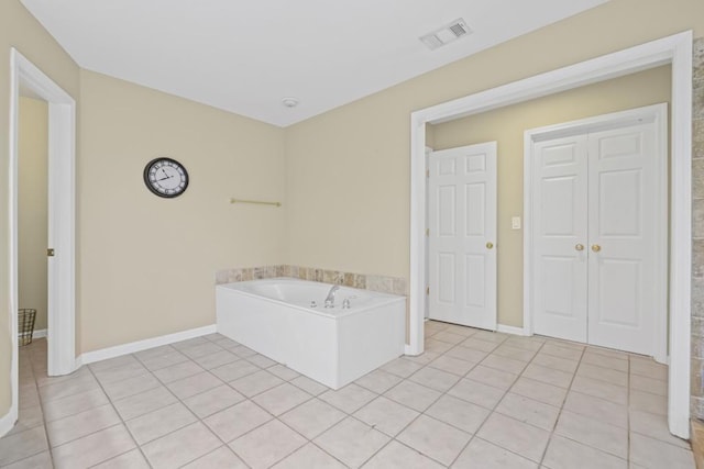 1465 Laleiah Dr, Cumming, GA 30041 - bathroom featuring baseboards, tile patterned flooring, a bath, and visible vents