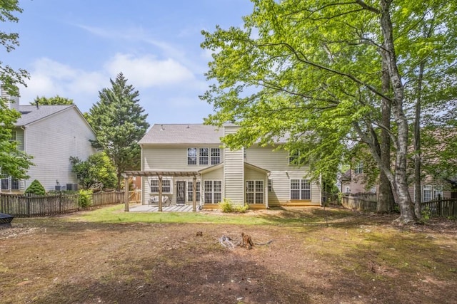 1465 Laleiah Dr, Cumming, GA 30041 - back of house featuring a fenced backyard, a yard, and a patio area