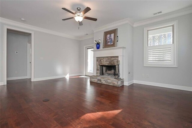 unfurnished living room featuring crown molding, ceiling fan, a fireplace, and dark wood-type flooring