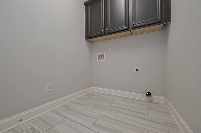 laundry room featuring cabinets, electric dryer hookup, and washer hookup