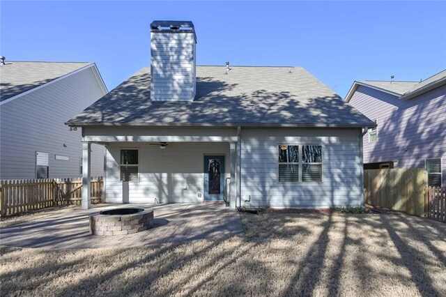 rear view of house featuring a fire pit, a patio area, and ceiling fan