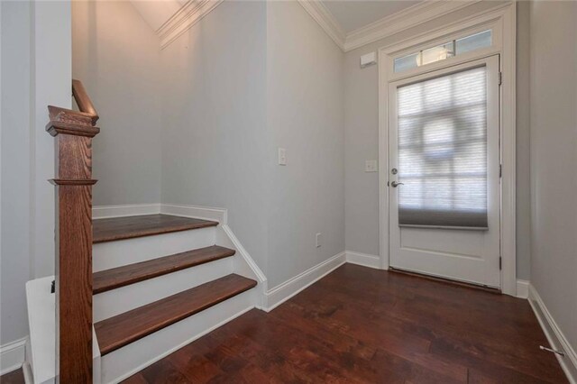 entryway with crown molding and dark wood-type flooring