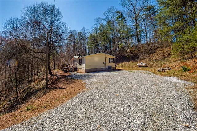 exterior space with crawl space and driveway