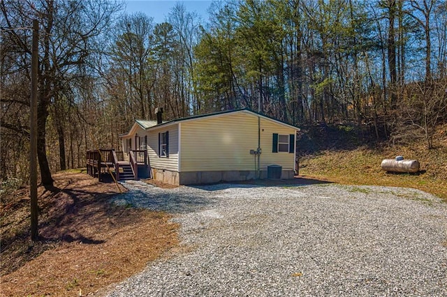 view of side of home featuring a deck