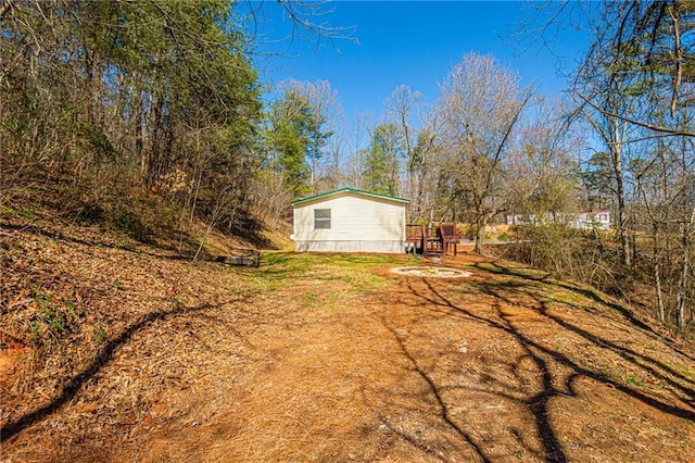 view of yard with a fire pit